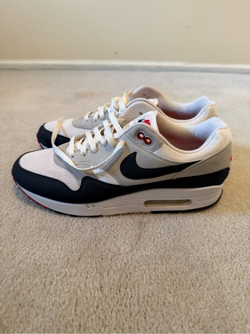 Nike Men’s Sneakers in White, navy and red accent